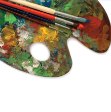 An artist's palette with paints and brushes.